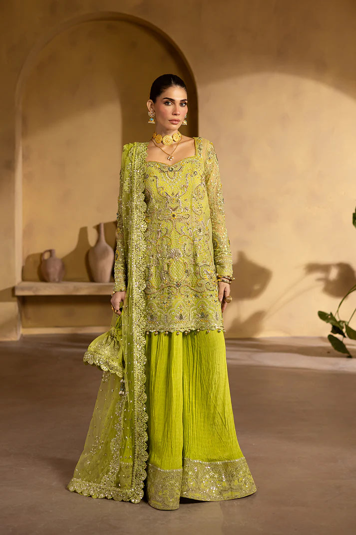 Lime yellow net dress with organza embroidery and raw silk trousers.