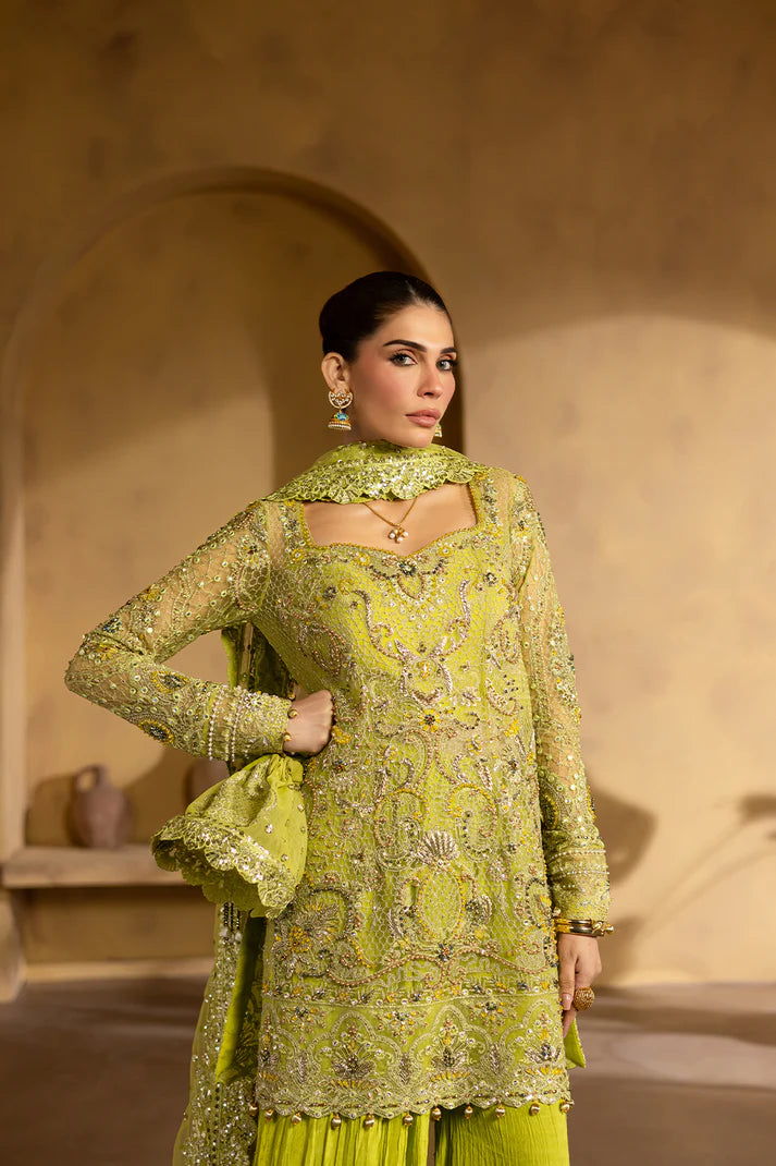 Lime yellow net dress with organza embroidery and raw silk trousers.
