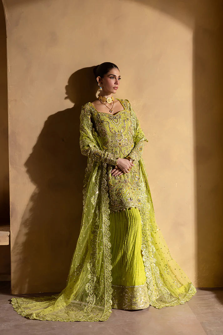 Lime yellow net dress with organza embroidery and raw silk trousers.