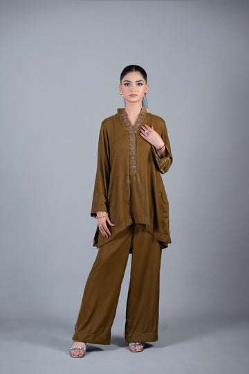 Bronze Muse mustard pure velvet co-ord set with embroidered neckline and high-low top by MariamRaj