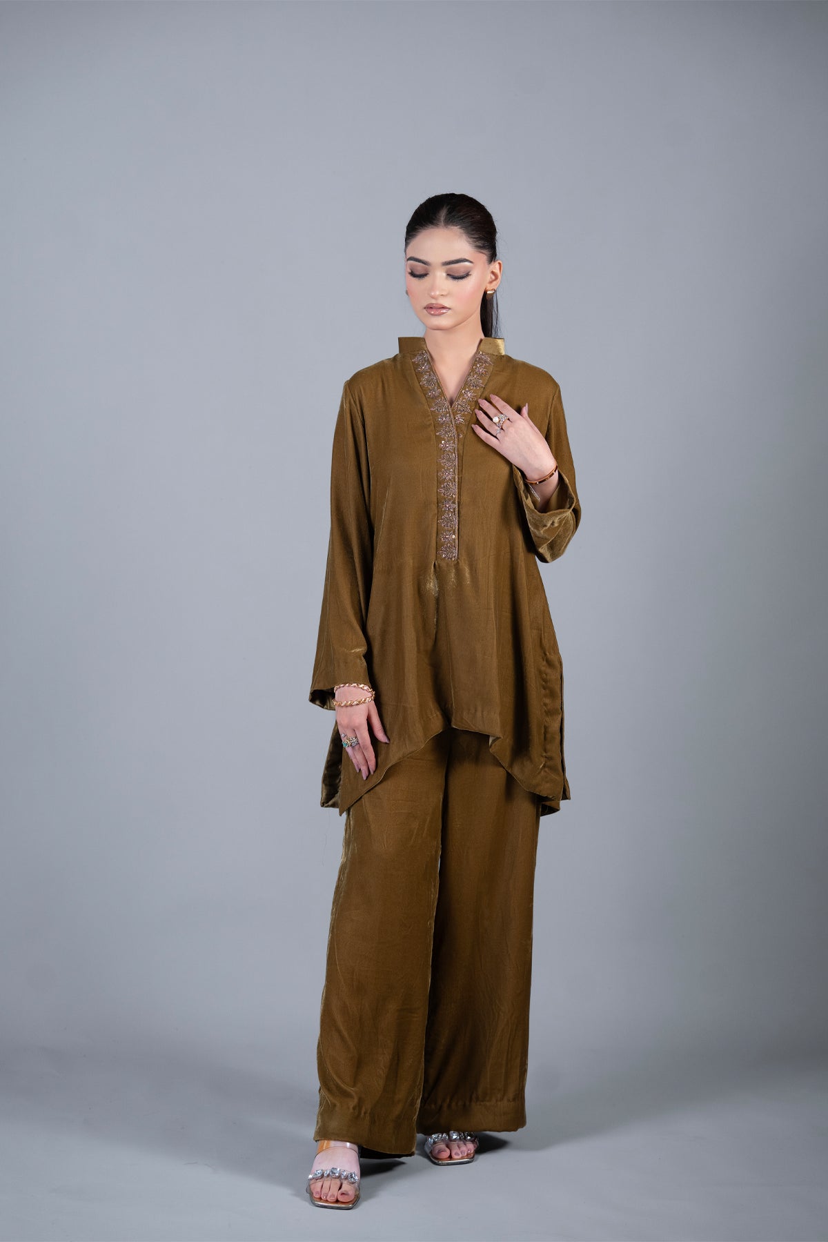 Bronze Muse mustard pure velvet co-ord set with embroidered neckline and high-low top by MariamRaj
