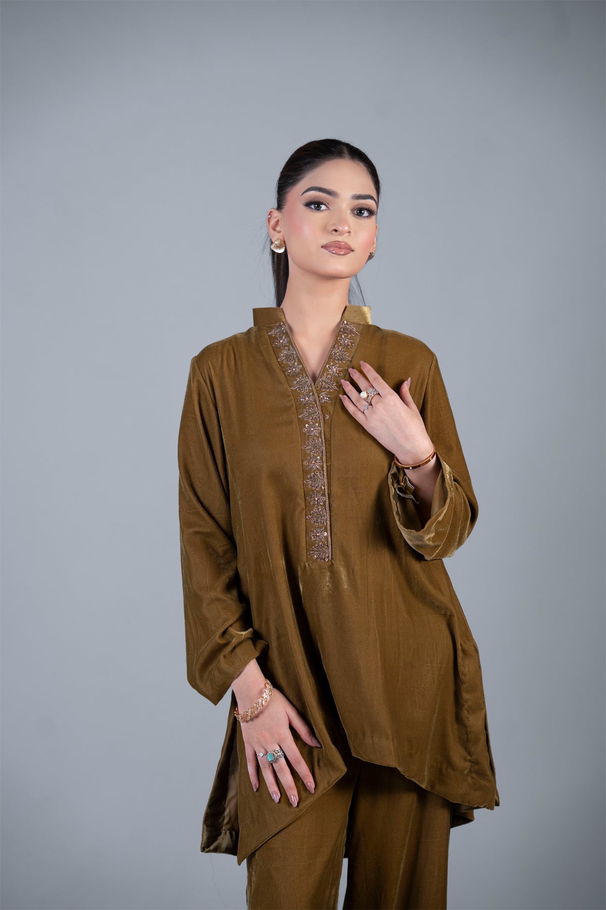 Bronze Muse mustard pure velvet co-ord set with embroidered neckline and high-low top by MariamRaj