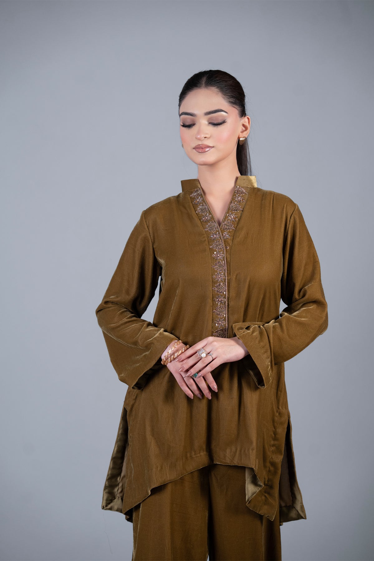 Bronze Muse mustard pure velvet co-ord set with embroidered neckline and high-low top by MariamRaj