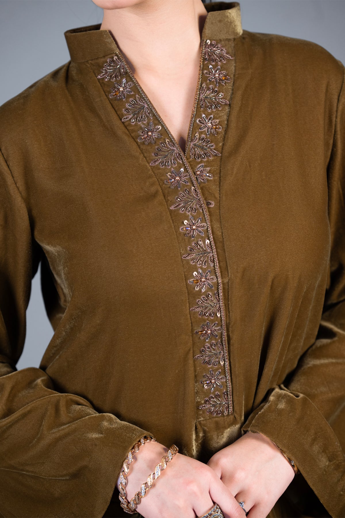 Bronze Muse mustard pure velvet co-ord set with embroidered neckline and high-low top by MariamRaj