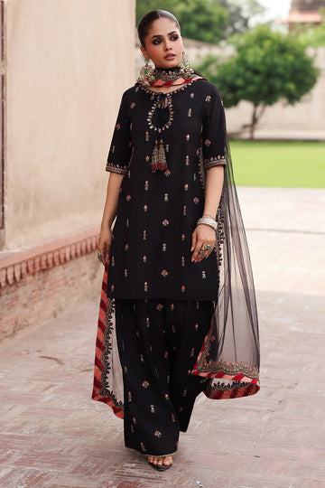 CMA-5-069 black raw silk embroidered Pakistani 3-piece formal suit with tassel neckline, embroidered shalwar, and poly net dupatta – shop online at Pakistanimoda.com.