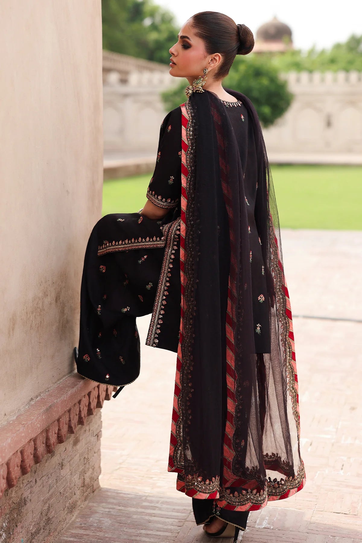 CMA-5-069 black raw silk embroidered Pakistani 3-piece formal suit with tassel neckline, embroidered shalwar, and poly net dupatta – shop online at Pakistanimoda.com.