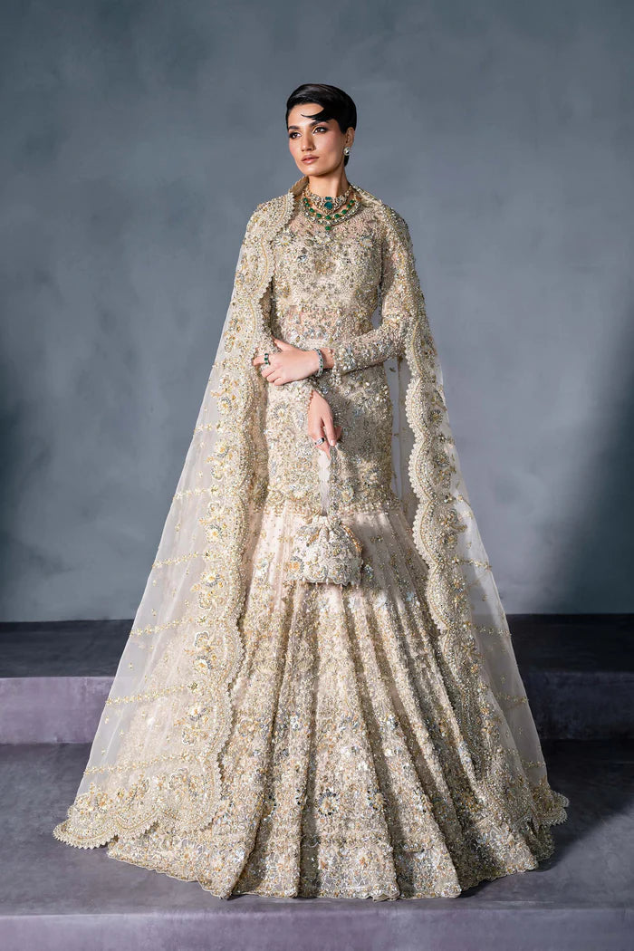 Luxury gold Pakistani bridal lehenga with hand embroidery, crystals, full sleeves, scalloped dupatta, and pouch – perfect for brides in USA, UK, Canada, and UAE.