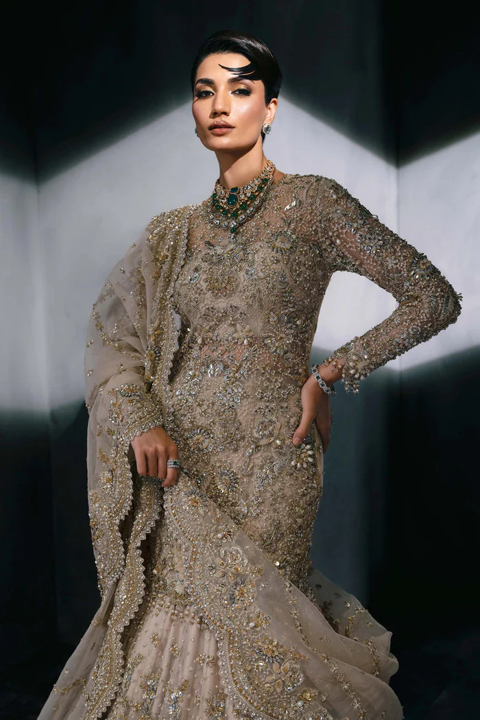 Luxury gold Pakistani bridal lehenga with hand embroidery, crystals, full sleeves, scalloped dupatta, and pouch – perfect for brides in USA, UK, Canada, and UAE.