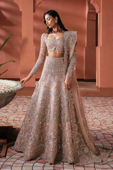 Elegant pink Pakistani bridal outfit for UK weddings, featuring a soft net lehenga and dupatta, hand-embellished with crystals, dabka, katdana, and traditional mukesh detailing.