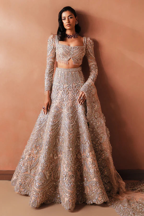 Elegant pink Pakistani bridal outfit for UK weddings, featuring a soft net lehenga and dupatta, hand-embellished with crystals, dabka, katdana, and traditional mukesh detailing.