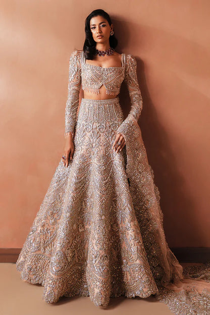 Elegant pink Pakistani bridal outfit for UK weddings, featuring a soft net lehenga and dupatta, hand-embellished with crystals, dabka, katdana, and traditional mukesh detailing.