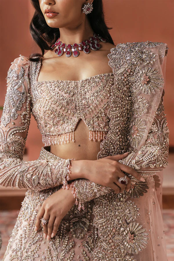 Elegant pink Pakistani bridal outfit for UK weddings, featuring a soft net lehenga and dupatta, hand-embellished with crystals, dabka, katdana, and traditional mukesh detailing.