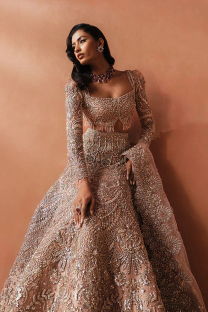 Elegant pink Pakistani bridal outfit for UK weddings, featuring a soft net lehenga and dupatta, hand-embellished with crystals, dabka, katdana, and traditional mukesh detailing.