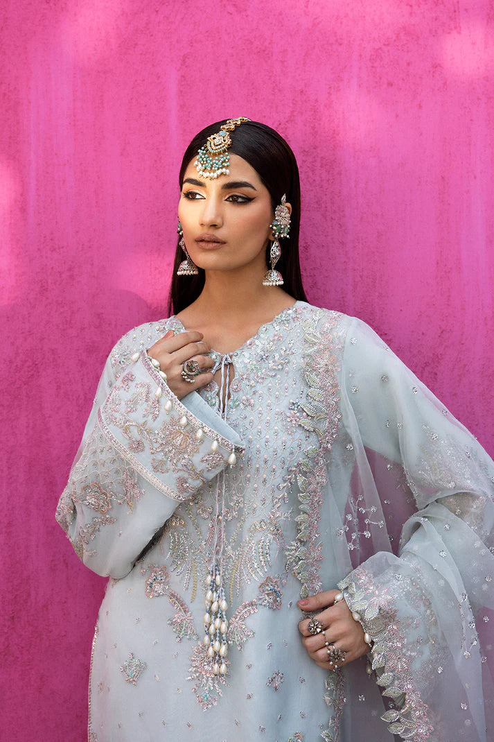 Cealina stylish ice blue organza embroidered suit with raw silk trouser and organza dupatta by Emaan Adeel, luxury pret wear for wedding guests.