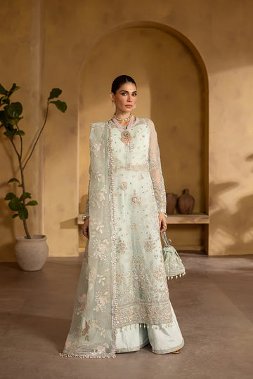 Sage green organza embroidered suit with silk trousers and pouch.