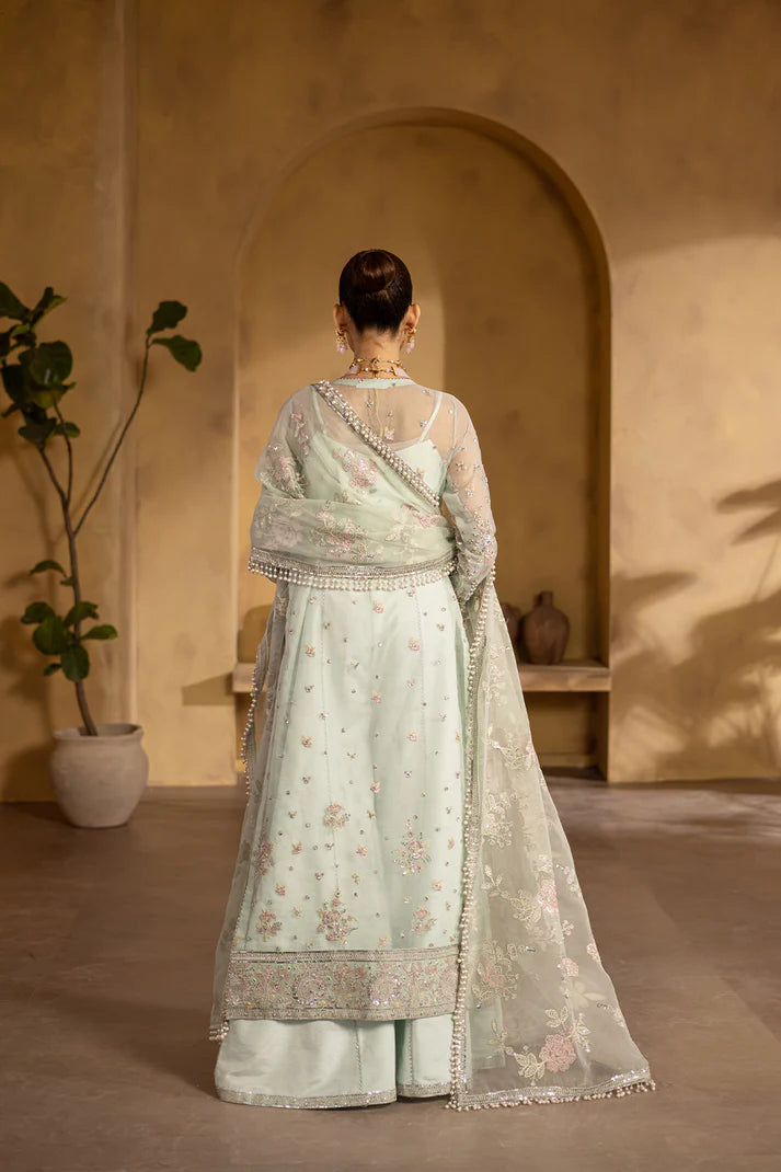 Sage green organza embroidered suit with silk trousers and pouch.
