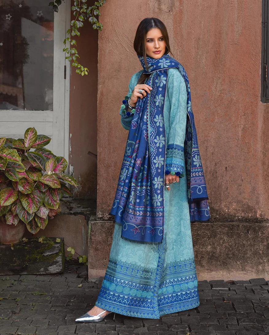 Model wearing Mushq Chianti Glow aqua jacquard embroidered winter suit with matching shawl – Winter Broadway 2025