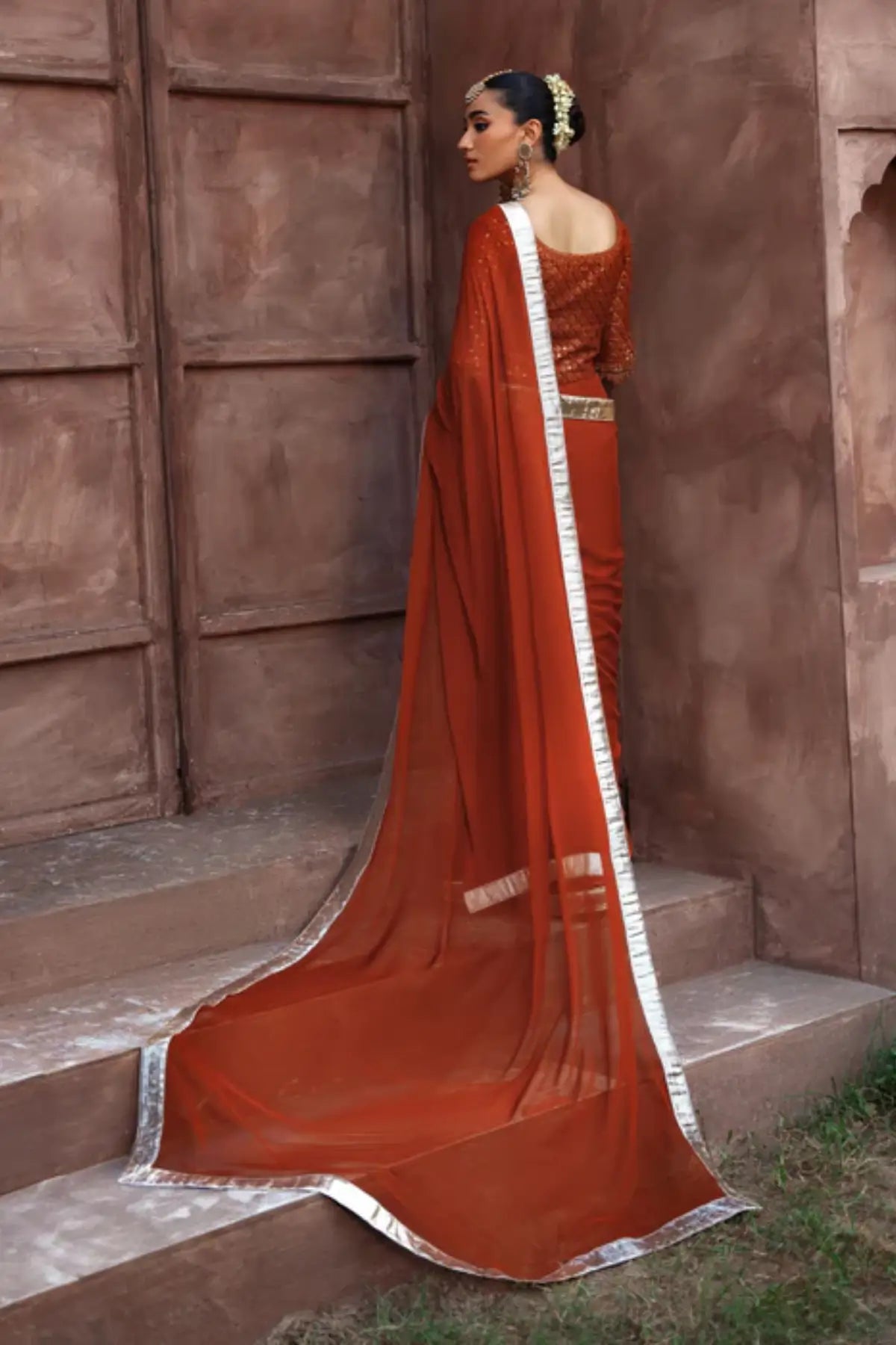 Coreene rust orange embroidered chiffon saree with blouse for wedding and festive wear