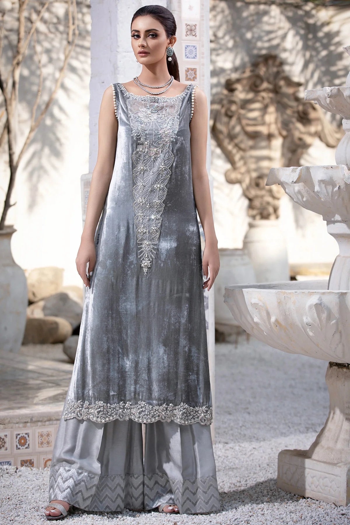 Grey velvet shirt with pearl and crystal detailing, paired with silk flared pants and matching organza dupatta – perfect for formal events 2025.