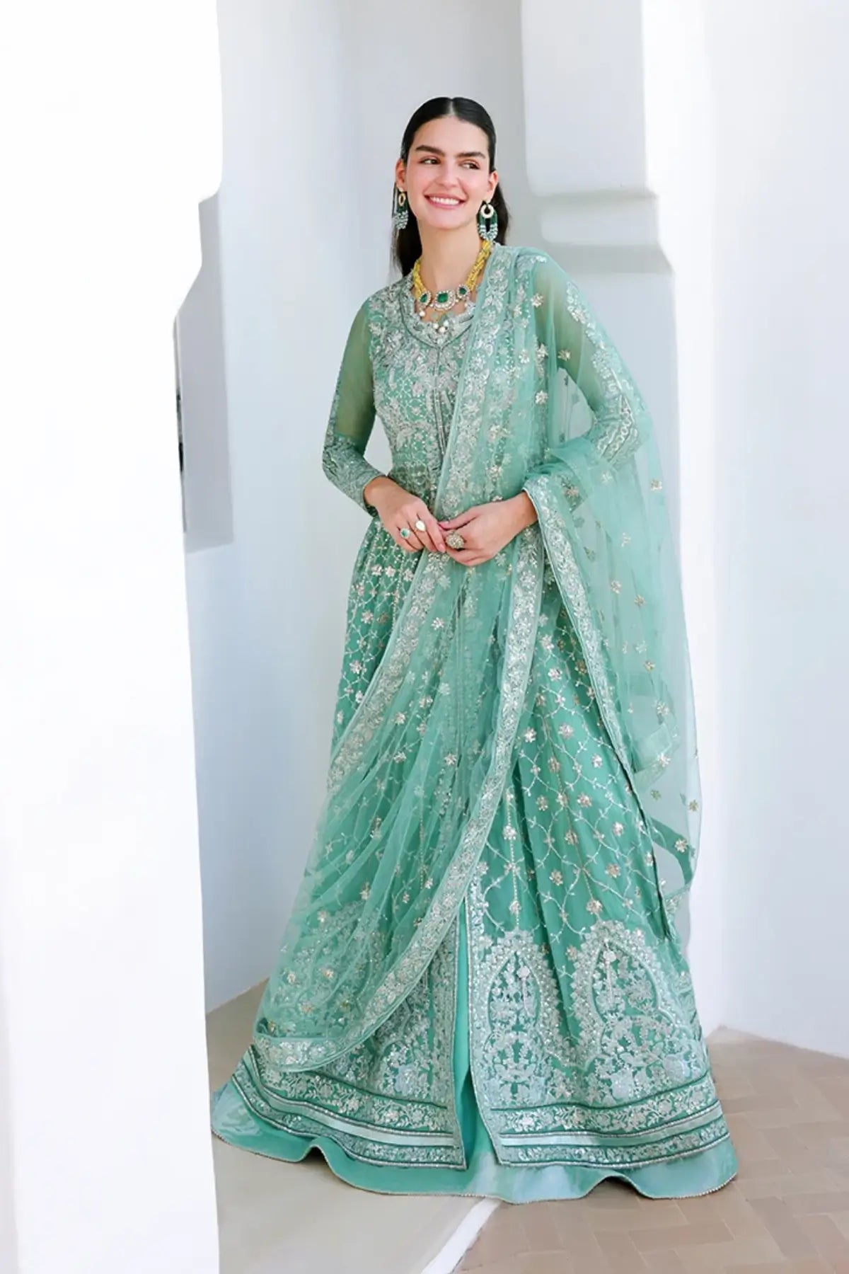 Dazzling Diva mint green hand embellished chiffon stitched suit with sequinned net dupatta and raw silk trouser