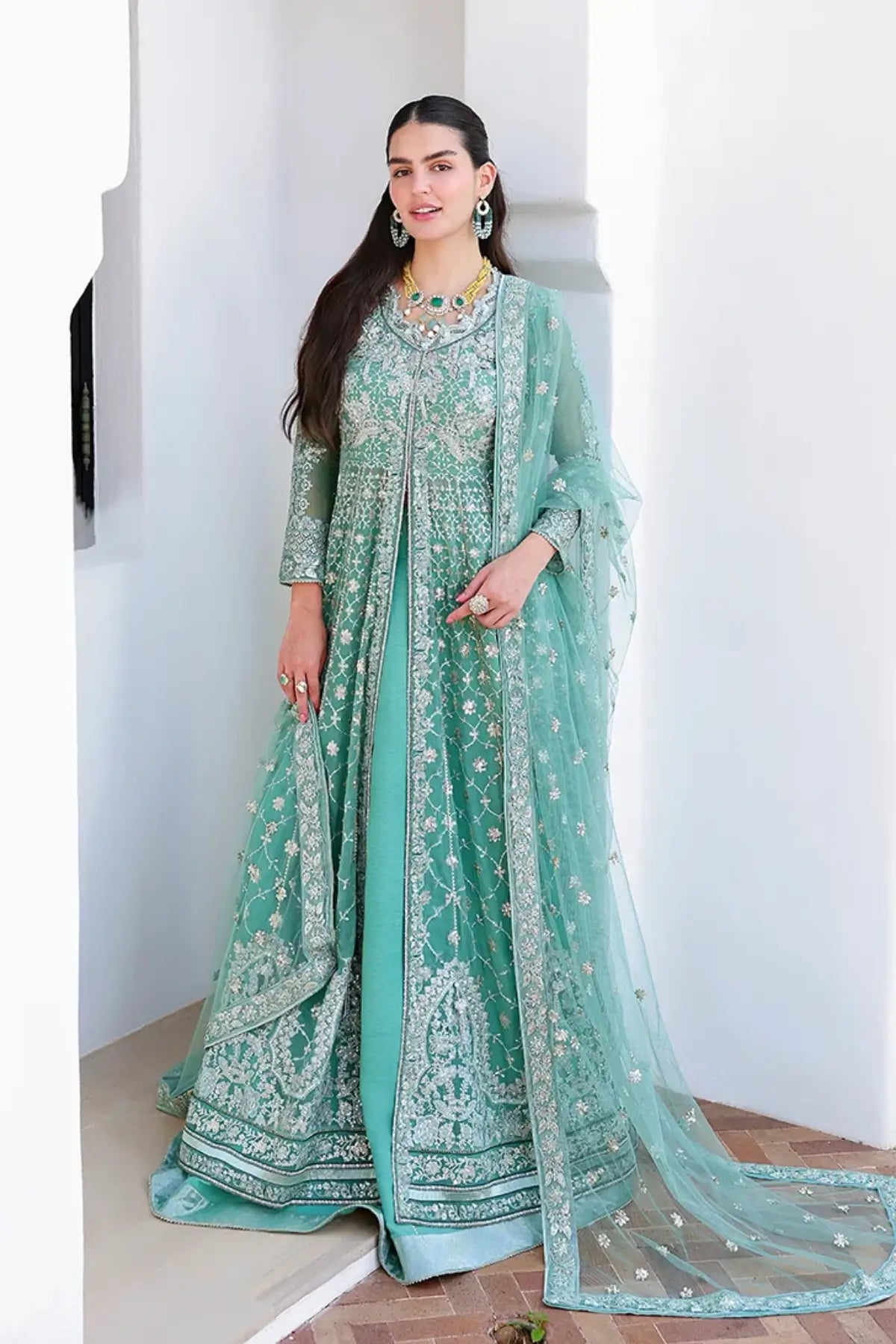 Dazzling Diva mint green hand embellished chiffon stitched suit with sequinned net dupatta and raw silk trouser
