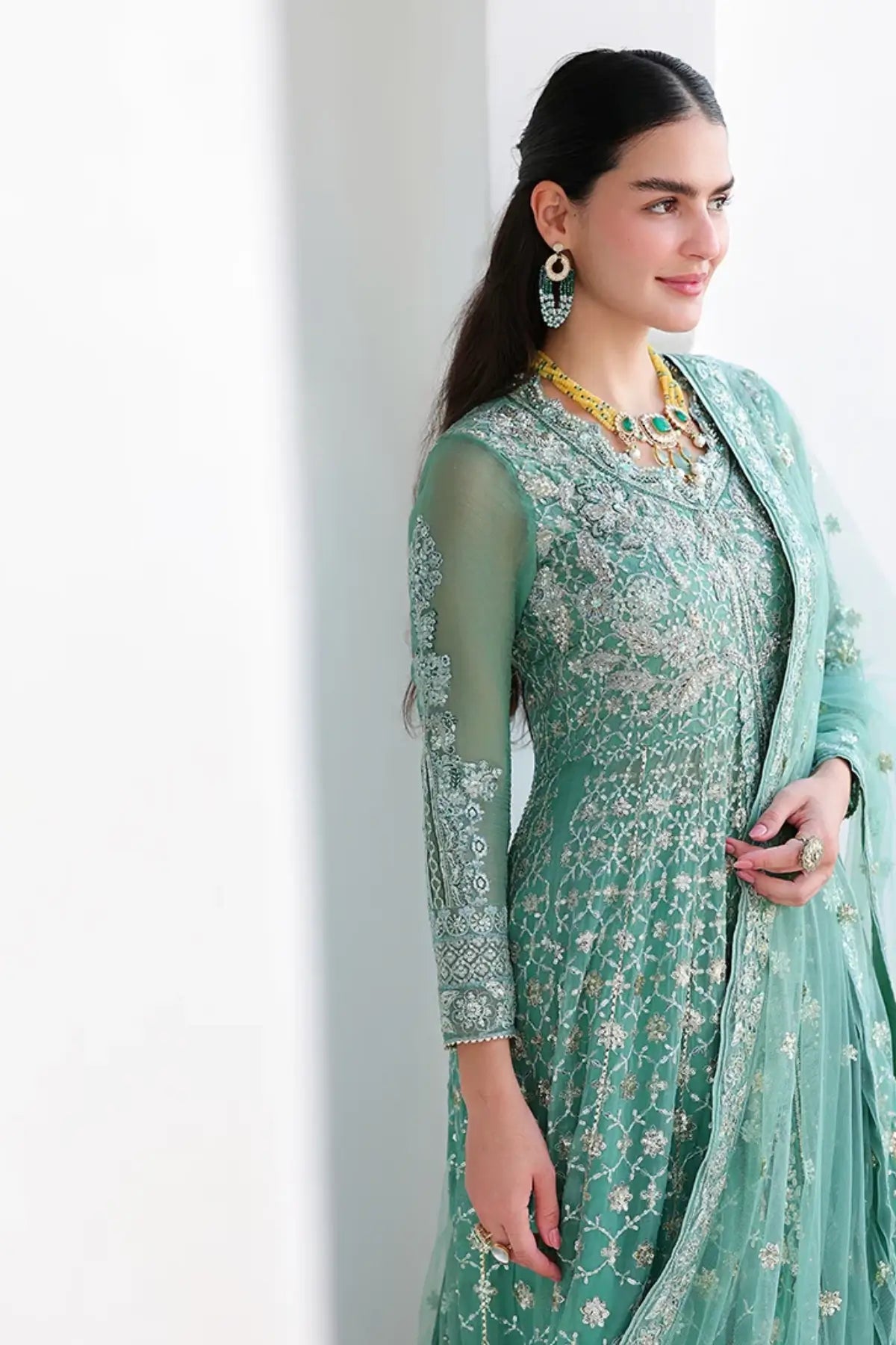 Dazzling Diva mint green hand embellished chiffon stitched suit with sequinned net dupatta and raw silk trouser