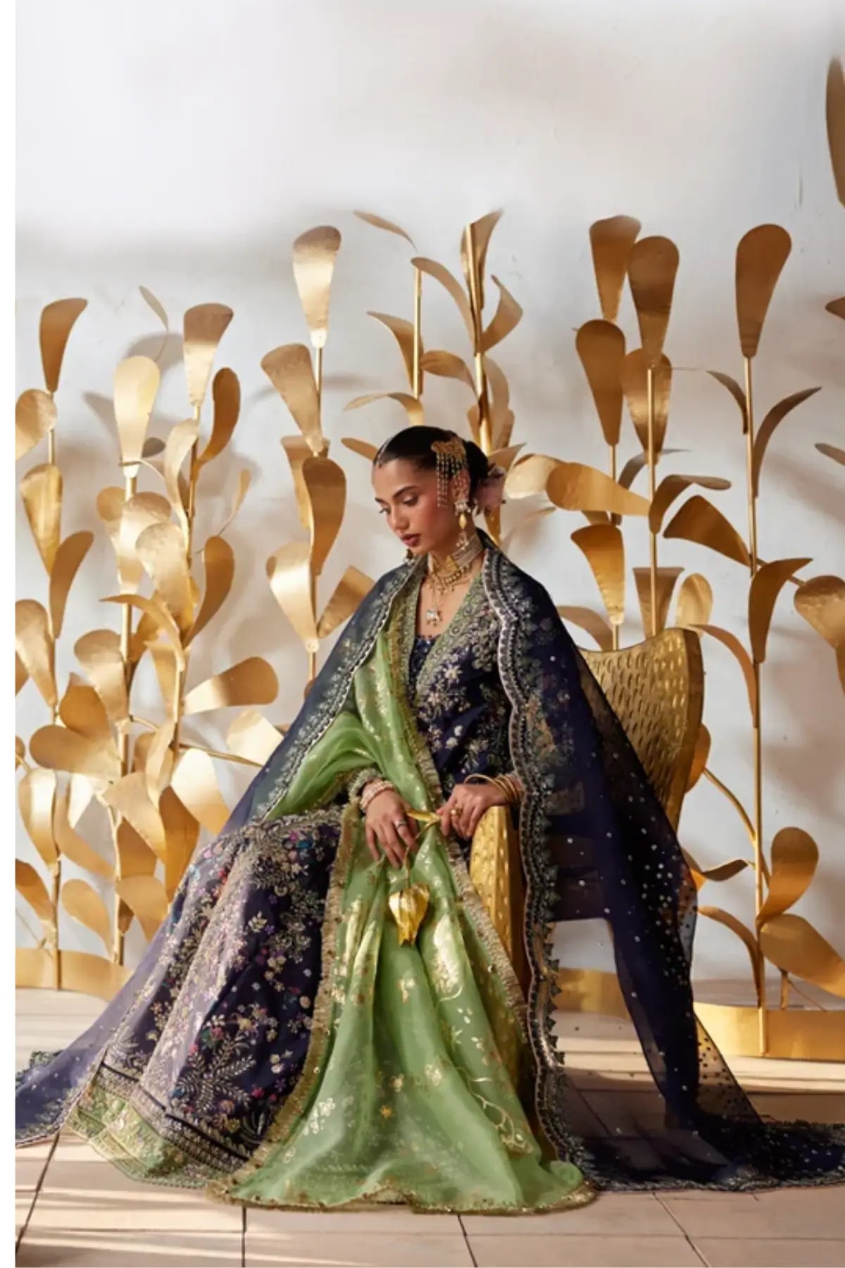 Delina midnight blue raw silk wedding pishwas gharara suit with sequin embroidery, green velvet borders and scalloped organza dupatta