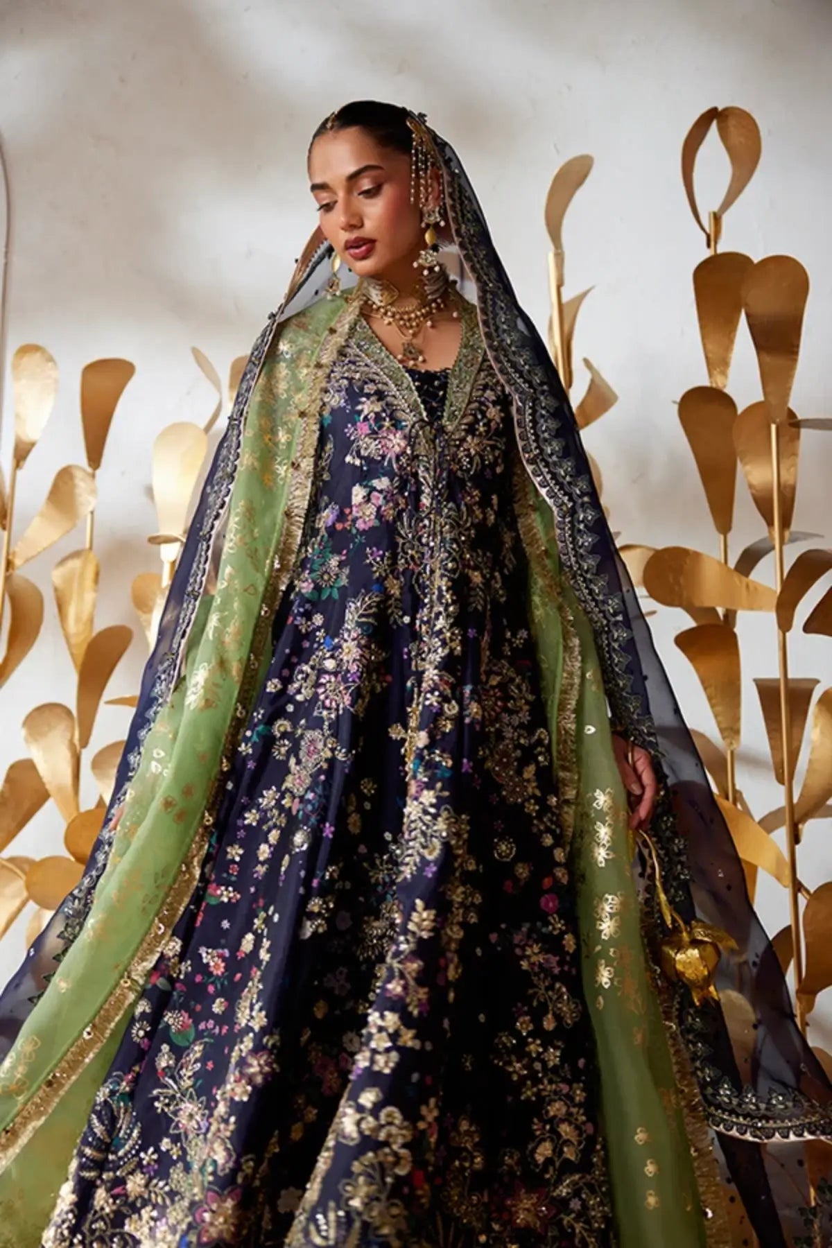 Delina midnight blue raw silk wedding pishwas gharara suit with sequin embroidery, green velvet borders and scalloped organza dupatta