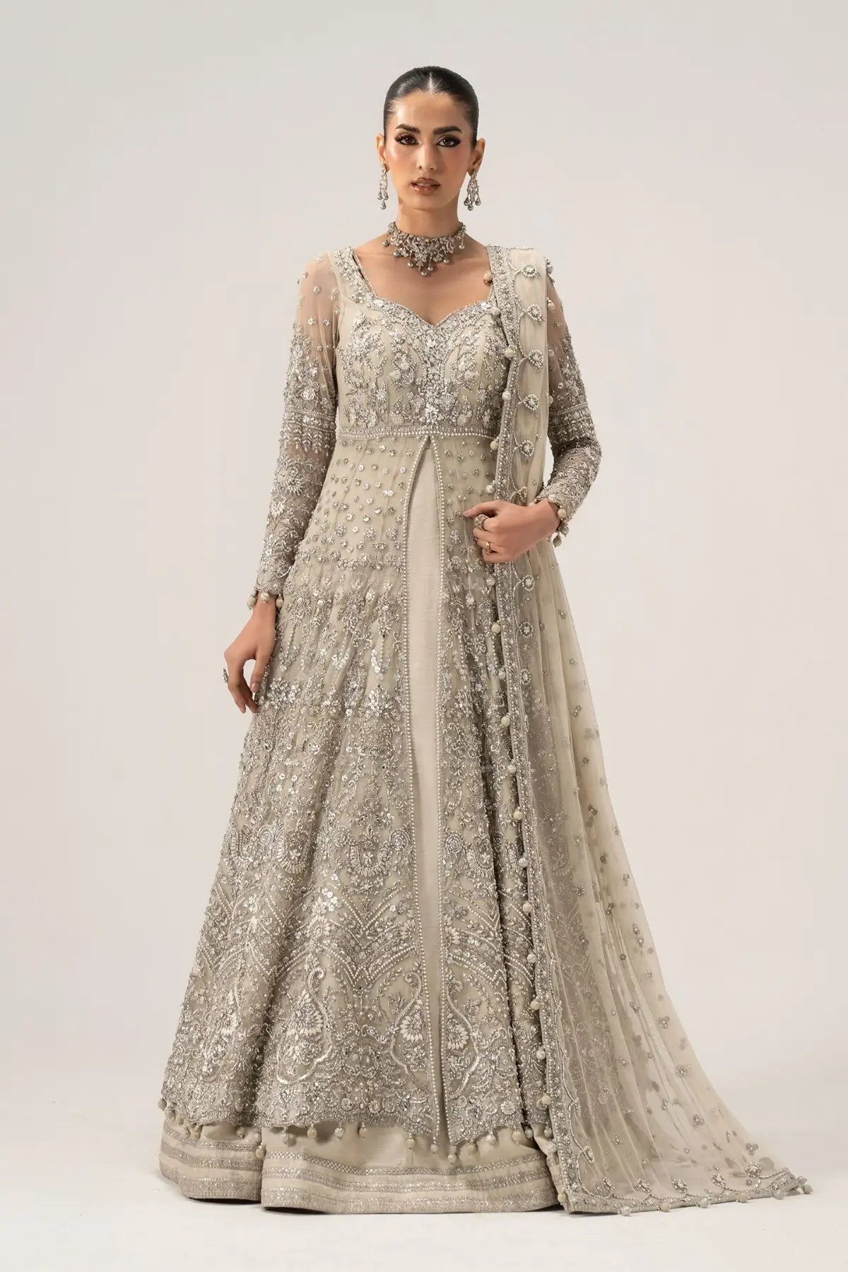 Elaria ivory embellished bridal gown by Maria B with net dupatta, pearl detailing and raw silk frock