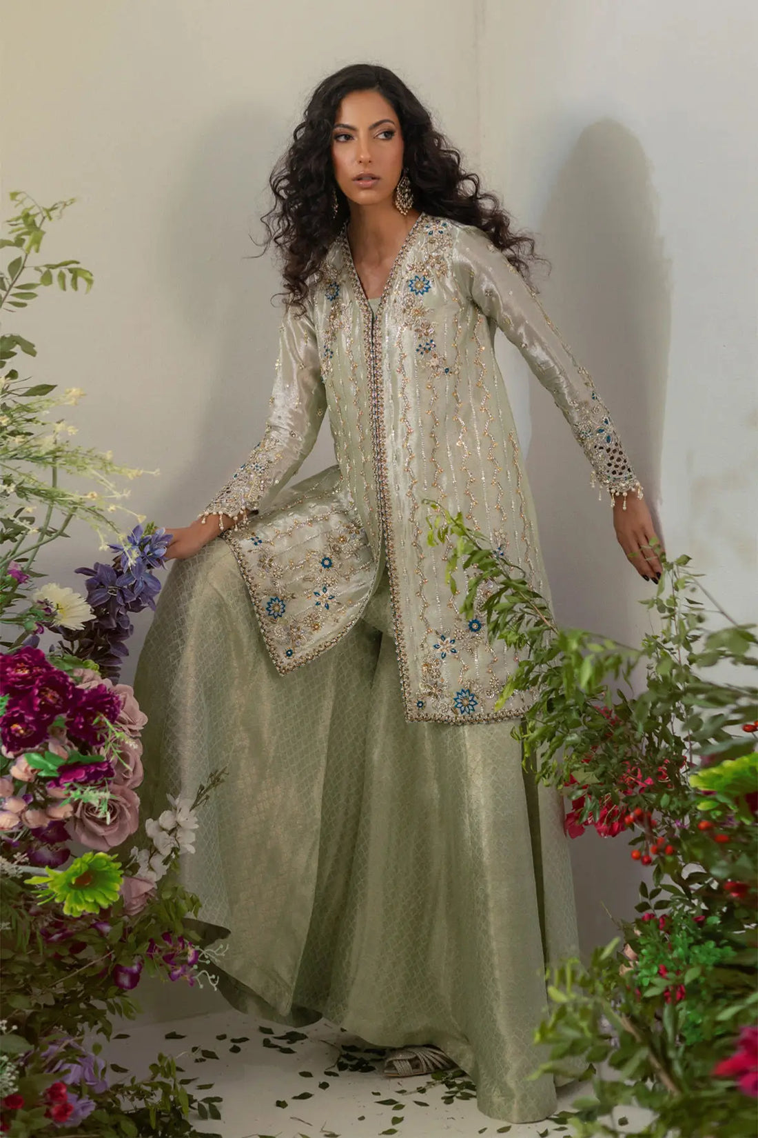 Silver gold embellished lamé jacket with flared pants featuring zardozi and tassel details for formal wear