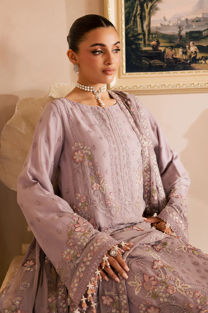 Soft lilac Pakistani chiffon suit with embroidered dupatta, organza borders, and raw silk trouser – ideal for Eid and formal wear in USA, UK, and Canada.

