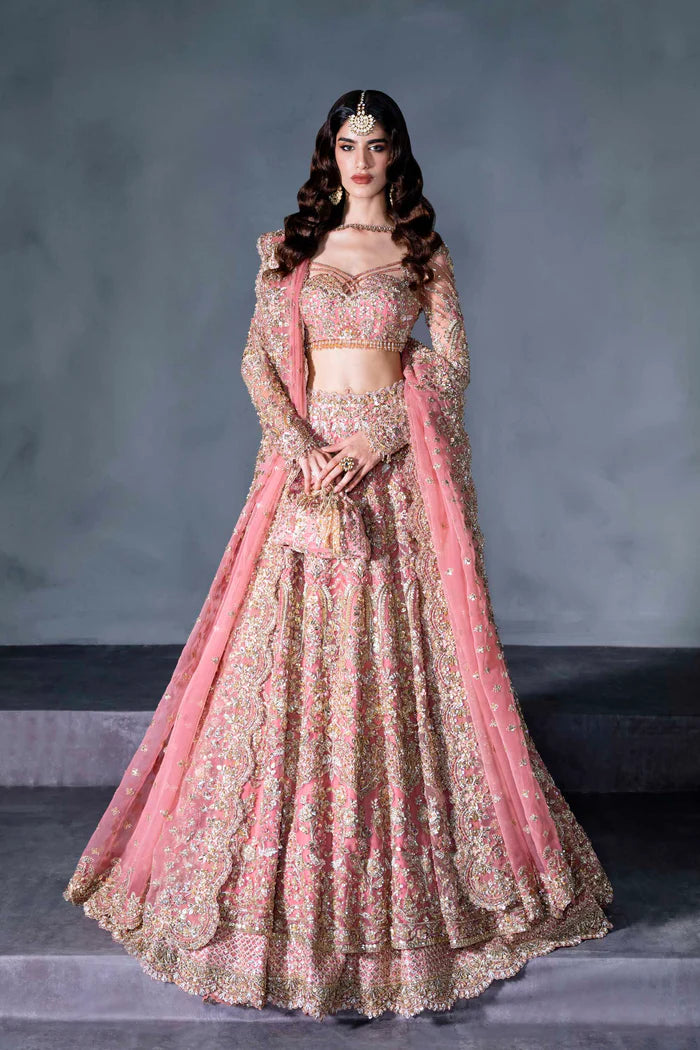 Blush pink Pakistani bridal lehenga with full sleeves, sheer dupatta, and handcrafted pouch – perfect for Desi brides in the USA, UK, Canada, and UAE.