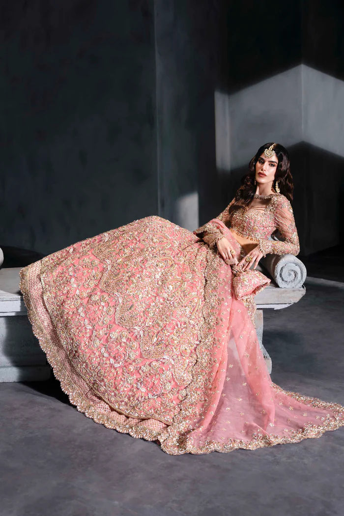 Blush pink Pakistani bridal lehenga with full sleeves, sheer dupatta, and handcrafted pouch – perfect for Desi brides in the USA, UK, Canada, and UAE.