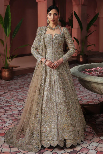 Soft peach pink Pakistani wedding outfit in luxe tissue fabric with aqua accents, hand-embellished with cutwork, dabka, and fine detailing; paired with a sheer net dupatta. Perfect for Pakistani brides in the UK.