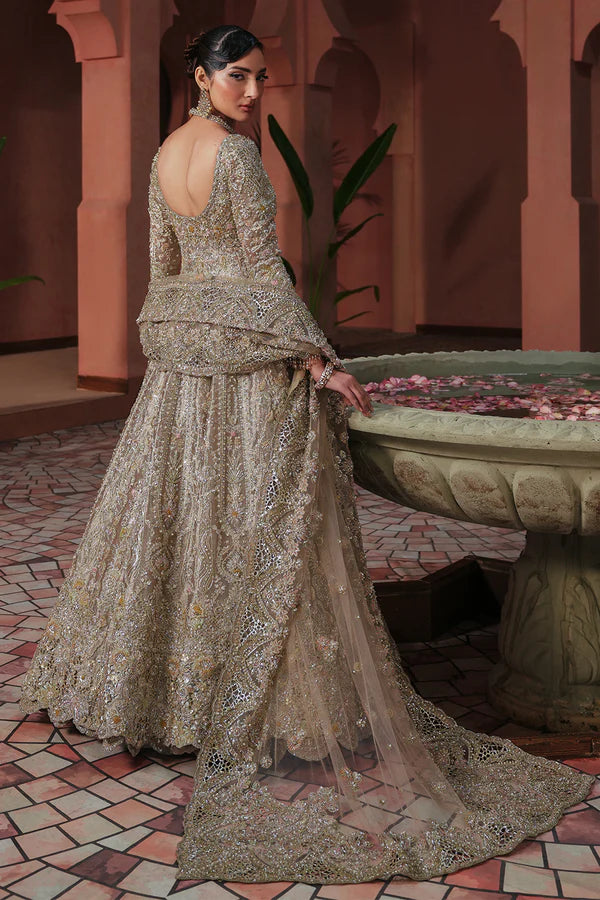 Soft peach pink Pakistani wedding outfit in luxe tissue fabric with aqua accents, hand-embellished with cutwork, dabka, and fine detailing; paired with a sheer net dupatta. Perfect for Pakistani brides in the UK.