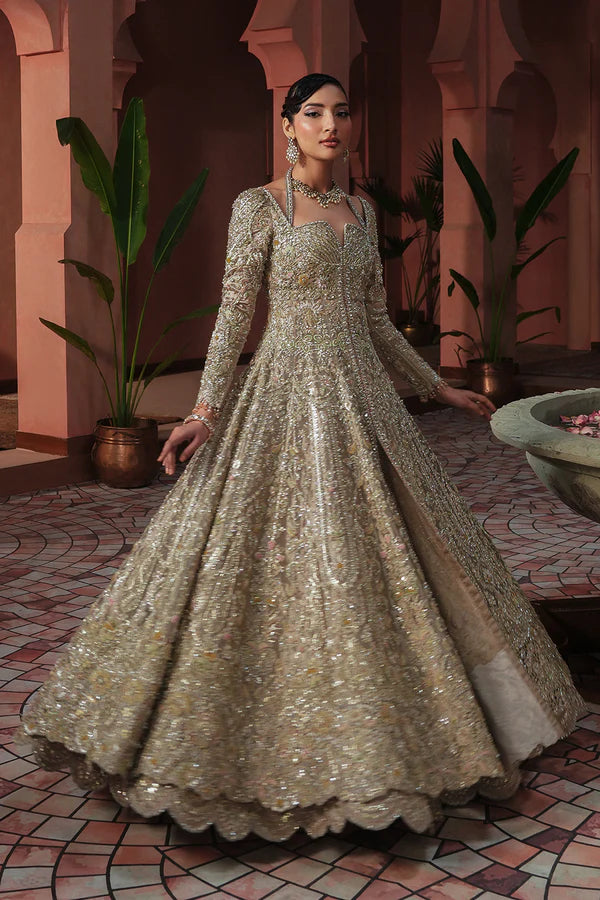 Soft peach pink Pakistani wedding outfit in luxe tissue fabric with aqua accents, hand-embellished with cutwork, dabka, and fine detailing; paired with a sheer net dupatta. Perfect for Pakistani brides in the UK.