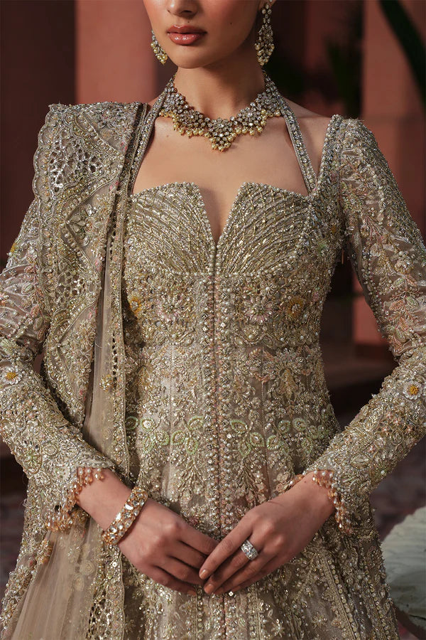 Soft peach pink Pakistani wedding outfit in luxe tissue fabric with aqua accents, hand-embellished with cutwork, dabka, and fine detailing; paired with a sheer net dupatta. Perfect for Pakistani brides in the UK.