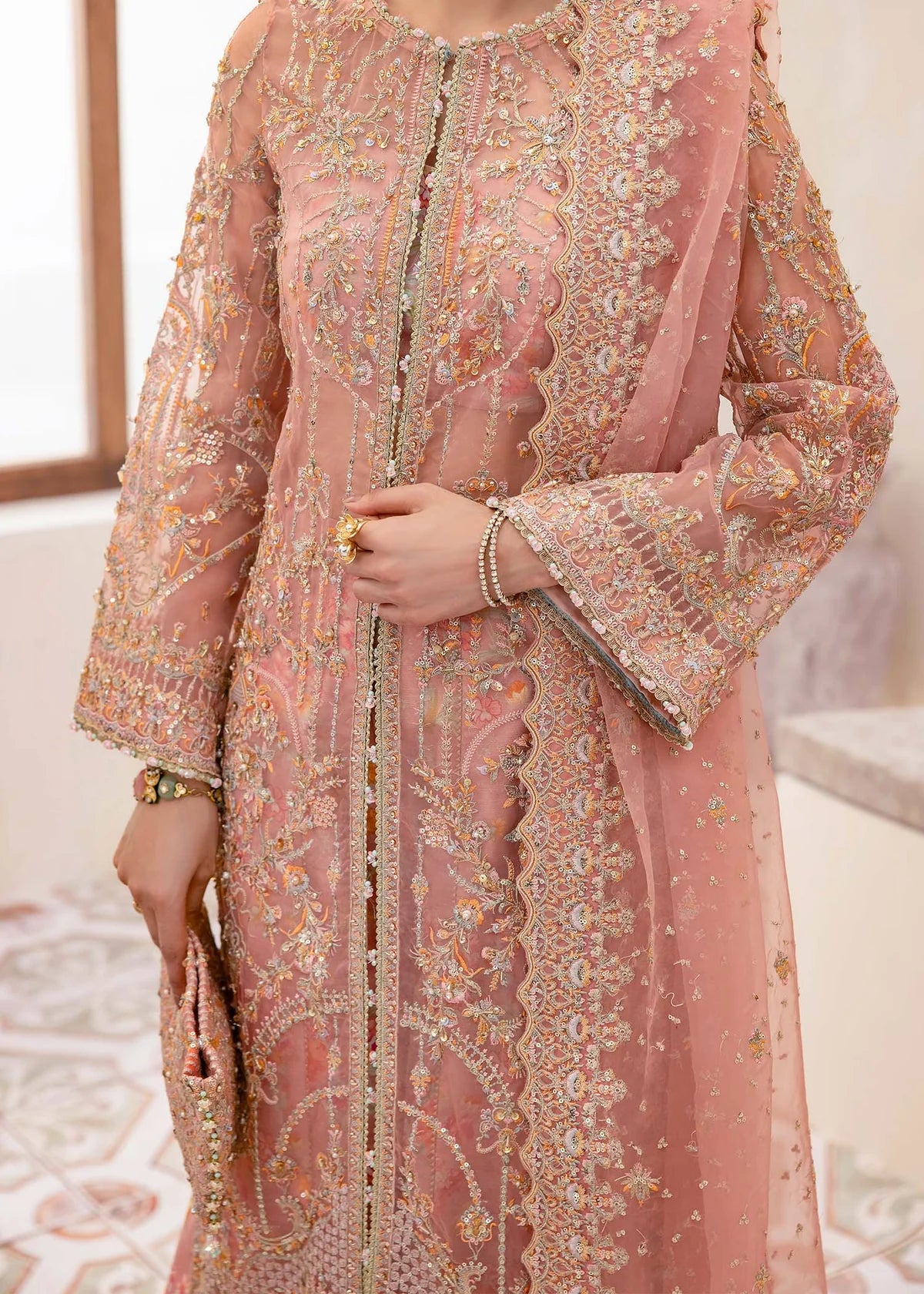 Peach organza Pakistani gown with sequin dupatta and printed flared trousers – ideal for formal wear and festive occasions in USA, UK, and Canada.