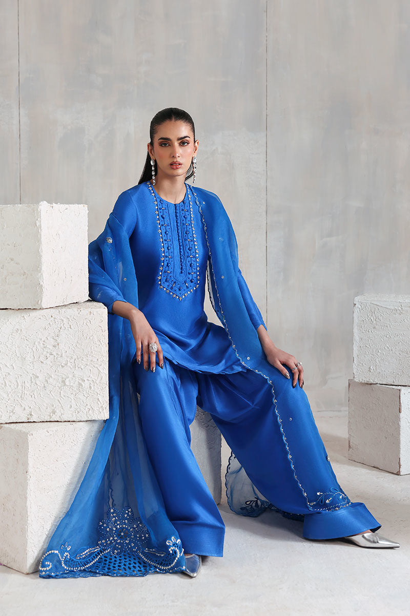 Blue Pakistani raw silk short shirt and trouser set with organza dupatta – elegant outfit for formal wear worldwide.