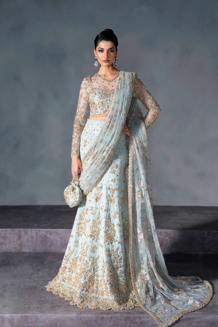 Powder blue bridal lehenga with gold embroidery, sheer sleeves, and pastel net dupatta – perfect for modern South Asian brides in USA, UK, Canada, and UAE.