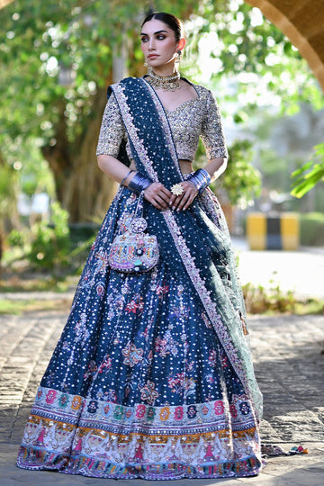 Teal printed Pakistani bridal lehenga choli with sweetheart neckline, geometric embellishments, and appliquéd net dupatta – perfect for brides in UK and Canada.