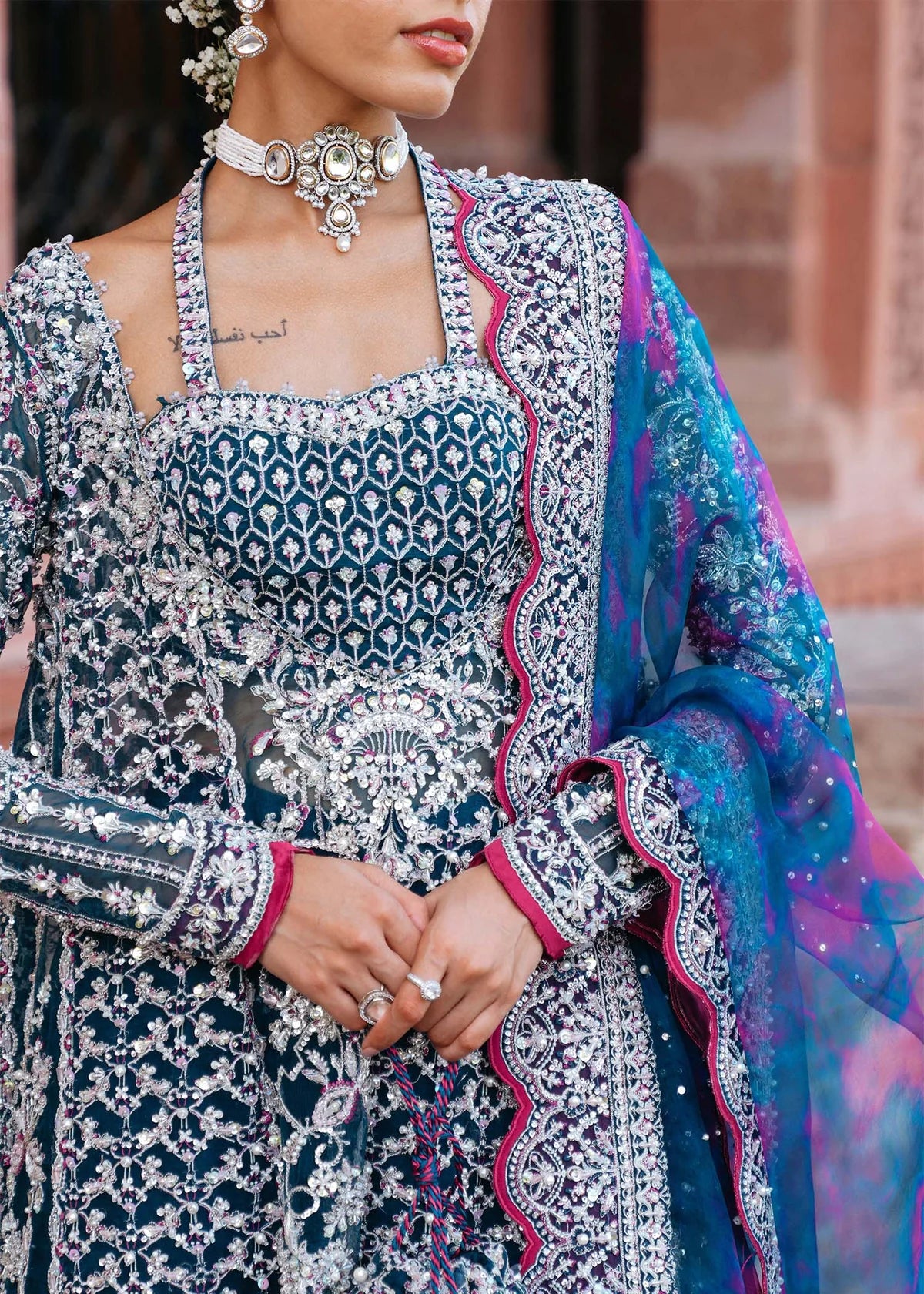 FEEHA – Teal bridal gharara suit with embroidered organza shirt, embellished bustier, silk gharara, and tie-dye dupatta. Online at Pakistanimoda.