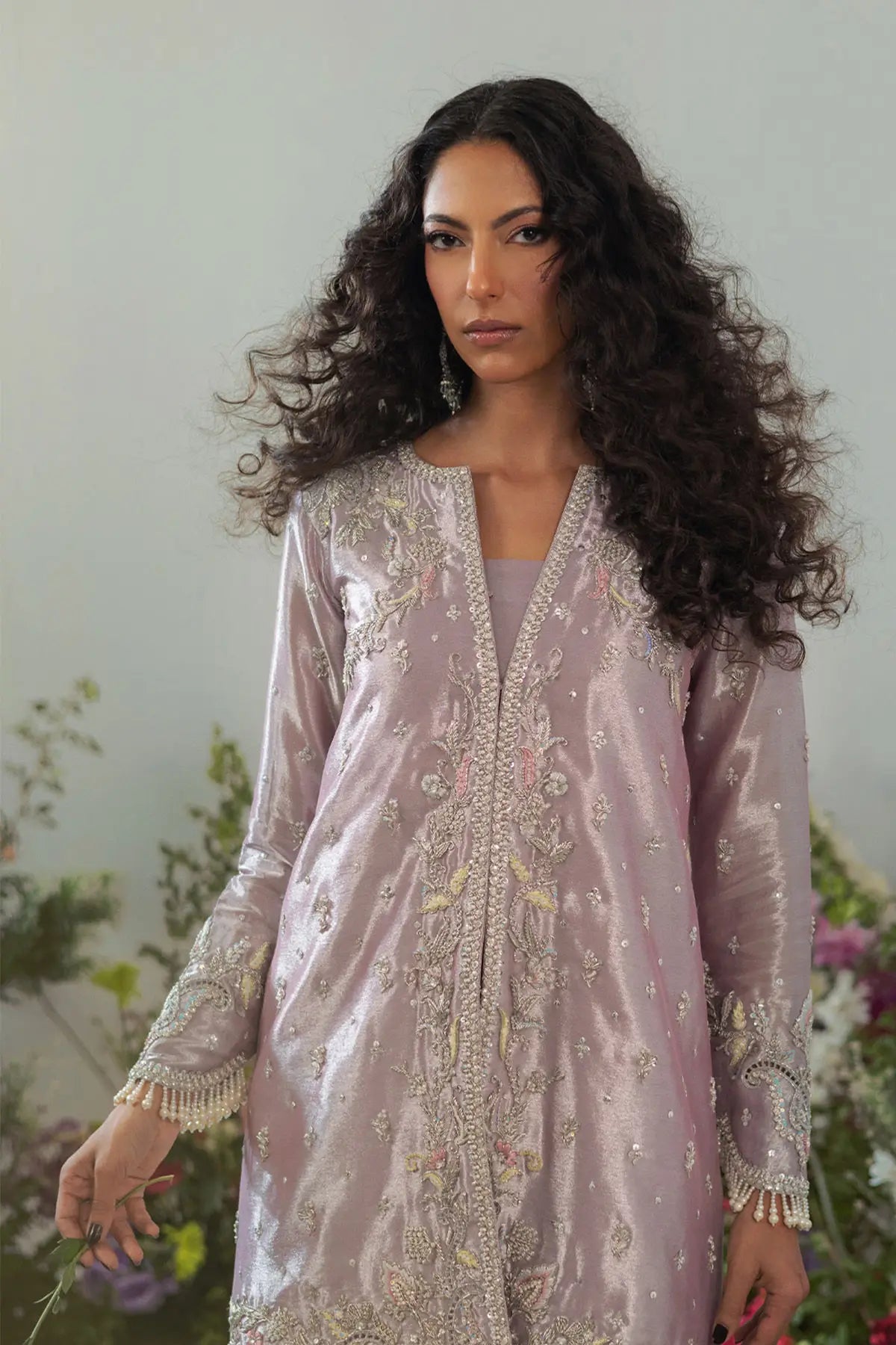 Elegant lilac lamé jacket set with zardozi and resham rosettes paired with flared pearl pants for special occasions