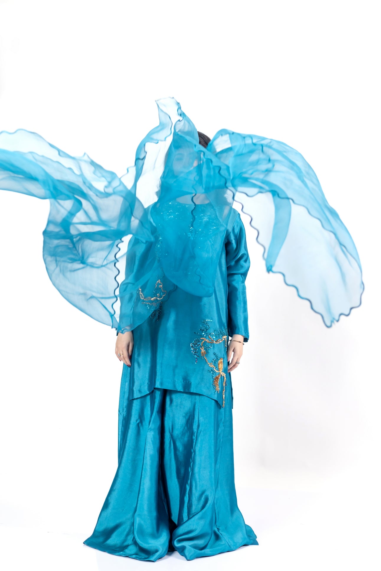 Faryal teal silk sharara set with sheesha silk shirt, flowing sharara, and organza dupatta with cutwork for evening events, dinner parties, and festive occasions by MariamRaj