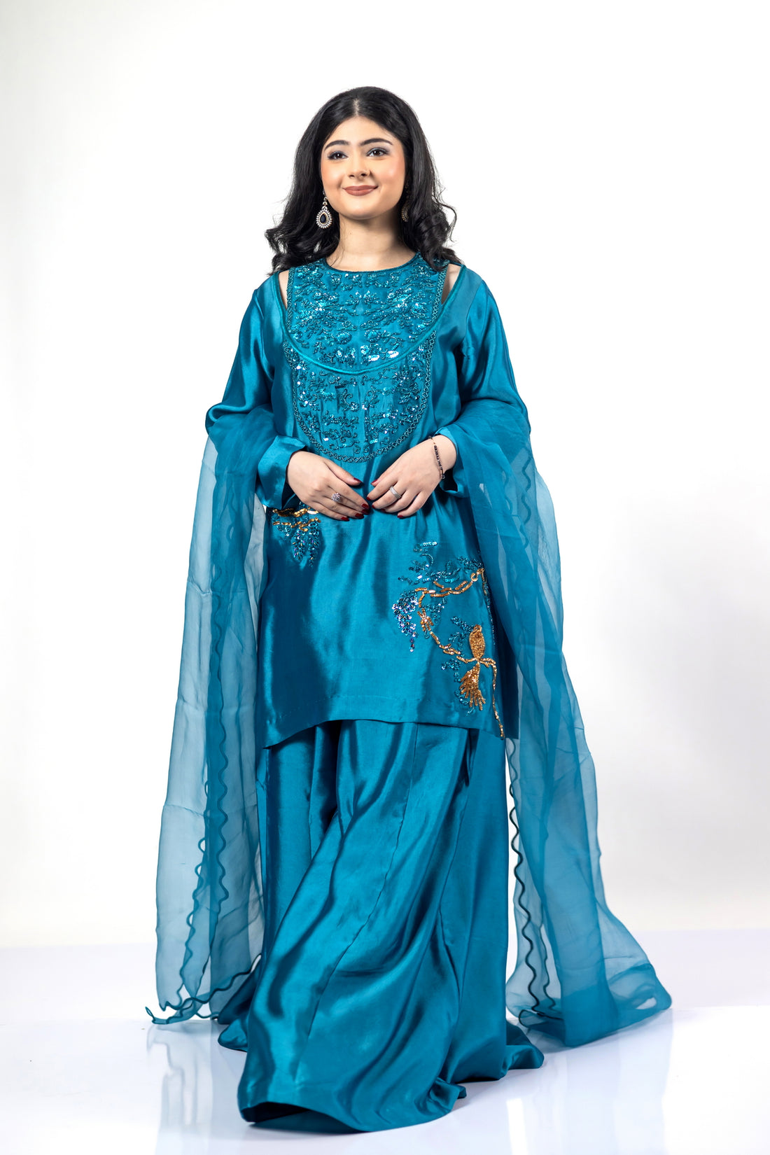 Faryal teal silk sharara set with sheesha silk shirt, flowing sharara, and organza dupatta with cutwork for evening events, dinner parties, and festive occasions by MariamRaj