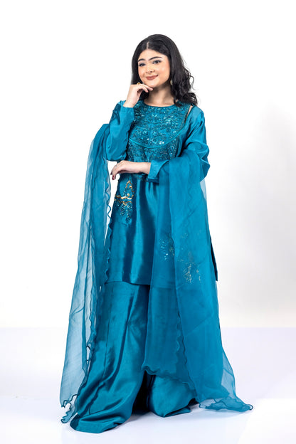 Faryal teal silk sharara set with sheesha silk shirt, flowing sharara, and organza dupatta with cutwork for evening events, dinner parties, and festive occasions by MariamRaj