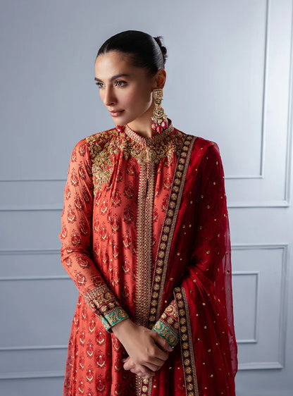 Feride by Zainab Chottani fiery orange-red embroidered shirt with sequence chan, paired with raw silk trousers and chiffon dupatta, perfect for festive events.