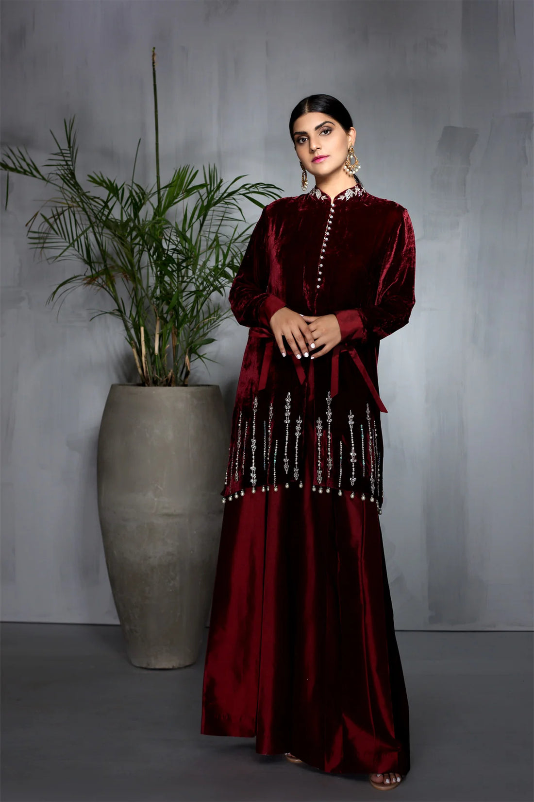 Maroon velvet short shirt with pearl and sequin embroidery, paired with flared taffeta pants – Pakistani formal wear for women at Pakistanimoda