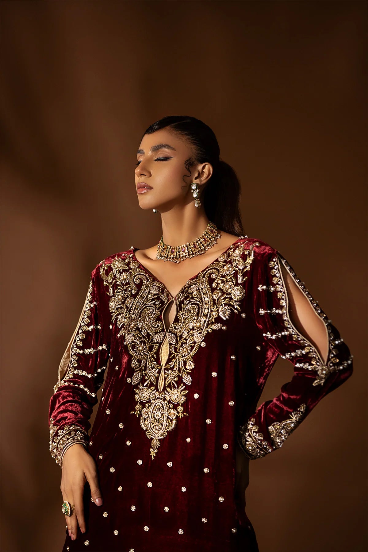 Maroon velvet shirt with heavy dabka and zardozi handwork, bootcut jamawar pants with organza hem, and matching organza dupatta – wedding outfit 2025.