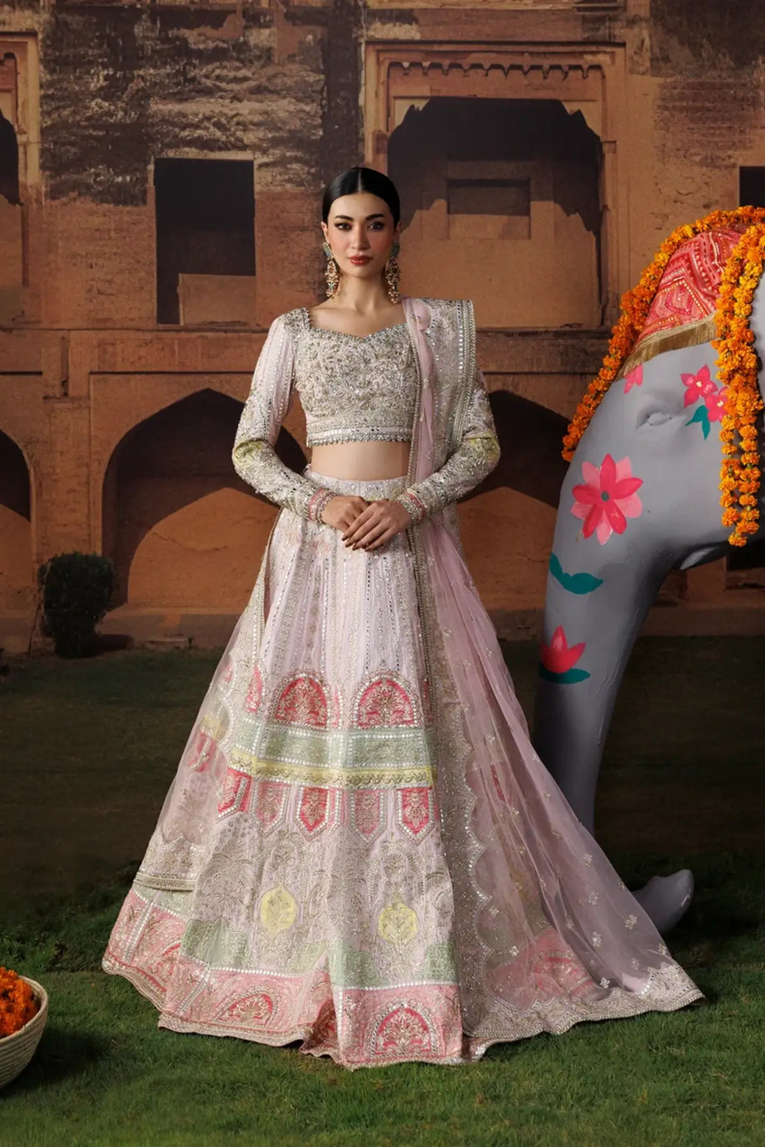 Gul-e-Roshan baby pink embroidered raw silk stitched lehenga choli with silver detailing and an elegant embellished poly net dupatta